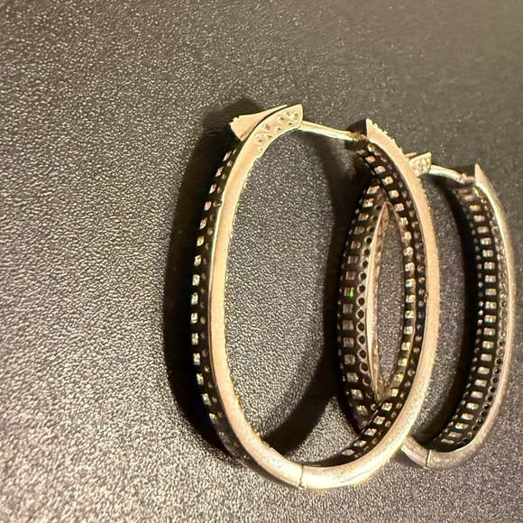 Elegant – These sparkling hoop earrings have a refined and sophisticated look. - Picture 4 of 14